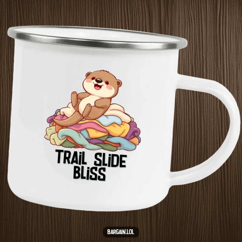 Funny camping mug showing a cute otter gleefully sliding down colorful garments, perfect for outdoor fun and humor.