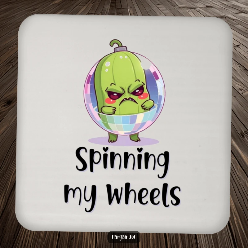 Funny coaster with a grumpy pickle stuck inside a sparkling disco ball, adding humor to drink protection.