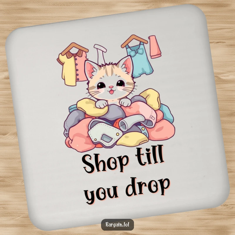 Funny kawaii kitten peeking from a pile of colorful thrift store clothes, designed to safeguard surfaces with cuteness.