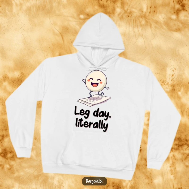 Funny hoodie with a smiling button character with legs hopping excitedly over a discarded crumpled receipt, perfect for a cozy, humorous feel.
