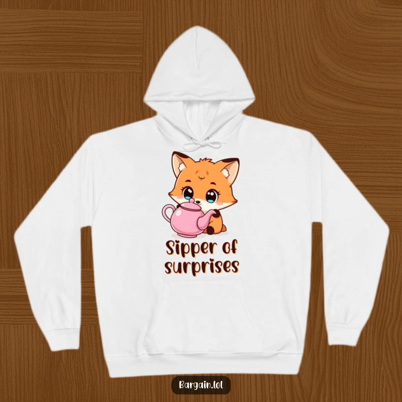 Funny Kawaii fox hoodie showing a fox with wide eyes admiring an affordable, quirky teapot, ideal for cozy charm.