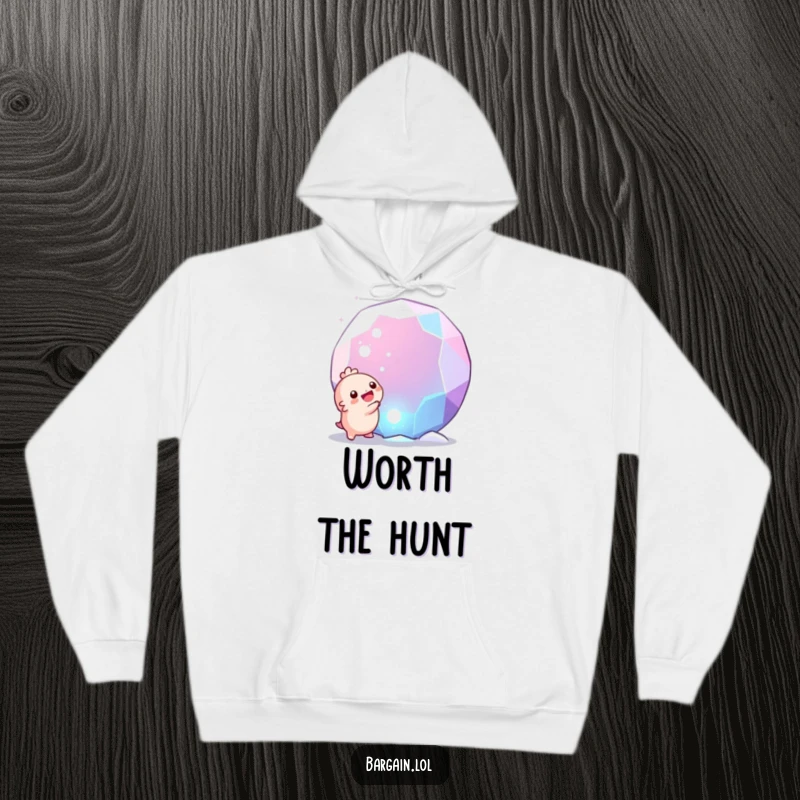 Funny hoodie: A cute, round creature experiencing pure glee upon finding a massive, glittering gem, showcasing humor and wonder.