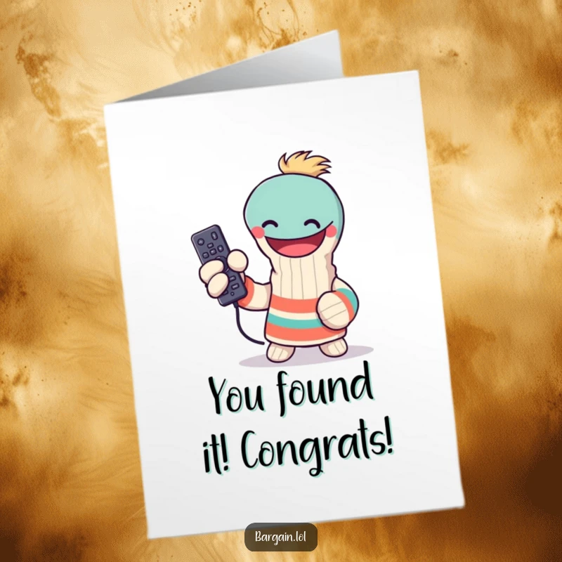 Funny Free Printable Congrats Card: Grinning sock puppet holds up a lost remote, celebrating a major win.