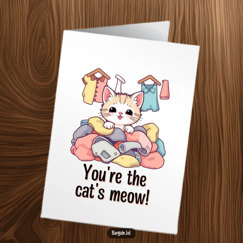Funny Free Printable Congratulations Card: A cute kawaii kitten happily emerges from a mountain of colorful, vintage thrift store clothing, celebrating success.