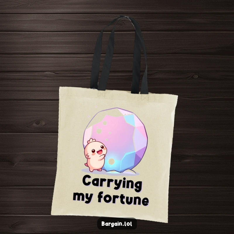 Funny tote bag: A tiny, round creature overjoyed by discovering a huge, shiny gem, making it a humorous accessory.