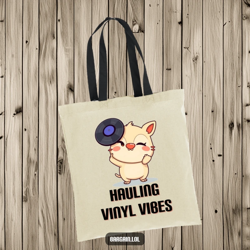 Funny Tote Bag: A mischievous creature winks while balancing a stack of vinyl records on its nose, perfect for carrying music.